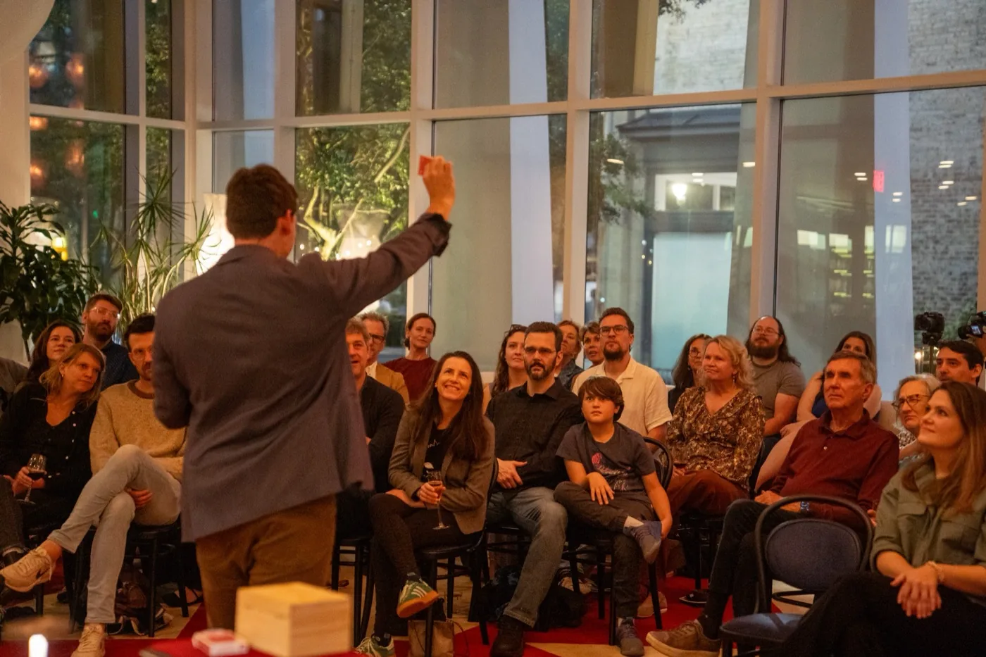 Michael performing a stand-up magic show on stage